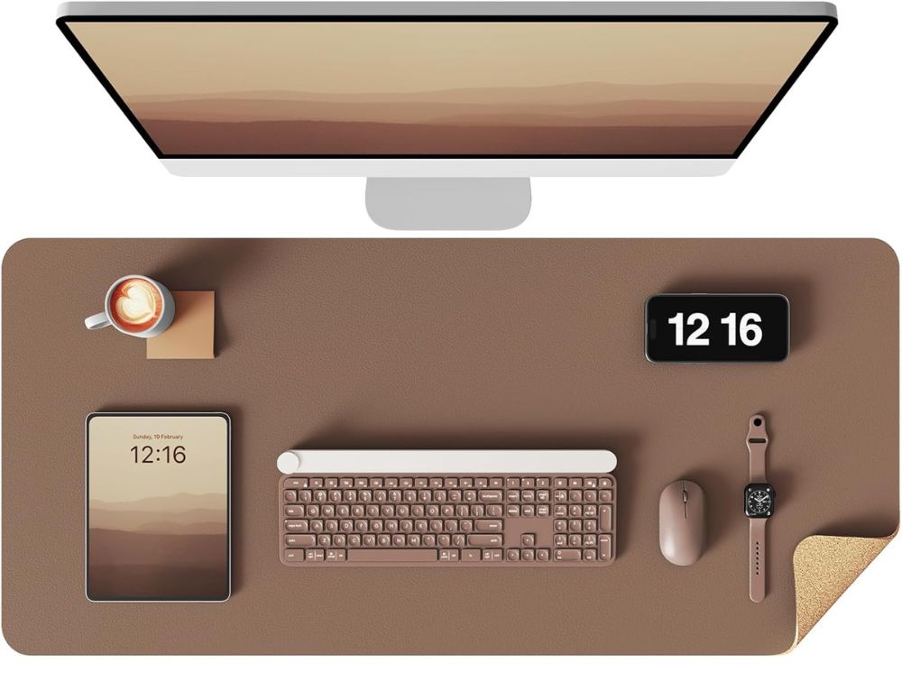 Cork and leather desk pad on wooden desk